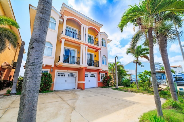 17817 Gulf Blvd Unit A, Saint Petersburg, FL 33708 - view of property featuring a garage and concrete driveway