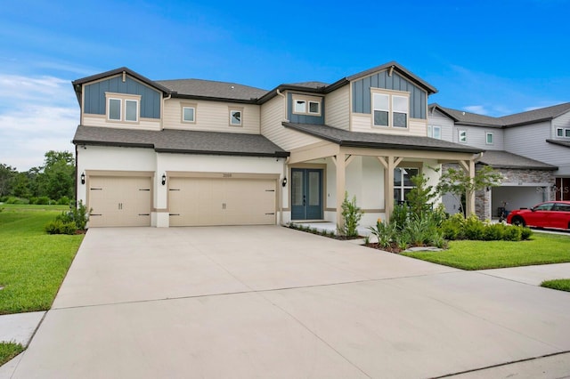 3559 Maple Bay Ln, Land O Lakes, FL 34638 - view of front facade with board and batten siding, a garage, a front lawn, concrete driveway, and a shingled roof