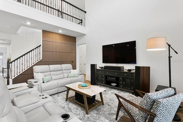 3559 Maple Bay Ln, Land O Lakes, FL 34638 - living room featuring a high ceiling and stairs