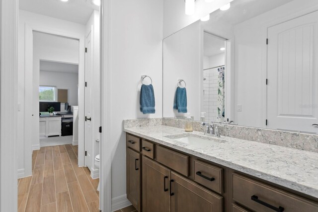 3559 Maple Bay Ln, Land O Lakes, FL 34638 - bathroom with vanity, wood finished floors, recessed lighting, and curtained shower