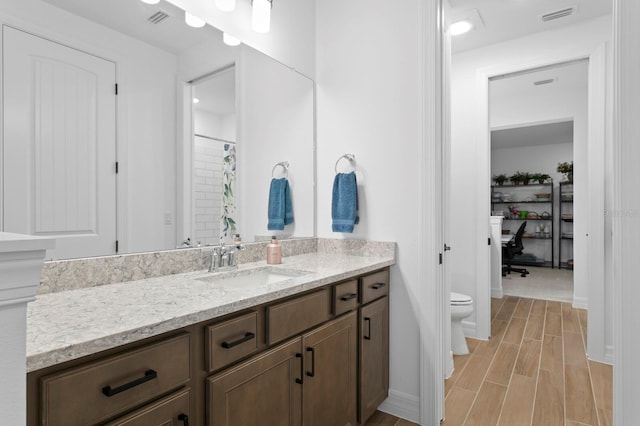 3559 Maple Bay Ln, Land O Lakes, FL 34638 - bathroom featuring vanity and wood finished floors