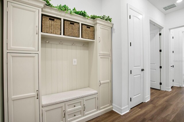 3559 Maple Bay Ln, Land O Lakes, FL 34638 - mudroom featuring dark wood finished floors and baseboards