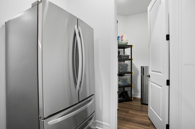 3559 Maple Bay Ln, Land O Lakes, FL 34638 - kitchen view of freestanding refrigerator and dark wood-style flooring