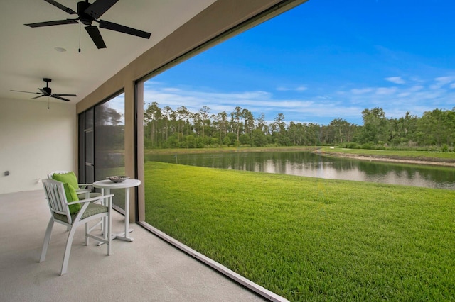 3559 Maple Bay Ln, Land O Lakes, FL 34638 - sunroom featuring a water view, carpet, and a view of trees