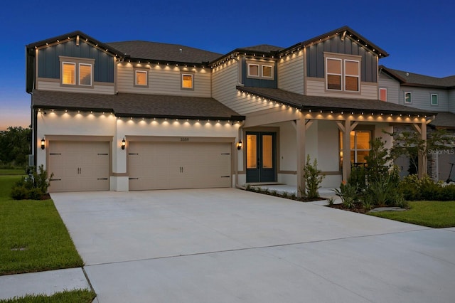 3559 Maple Bay Ln, Land O Lakes, FL 34638 - view of front facade featuring board and batten siding, roof with shingles, driveway, a garage, and a porch