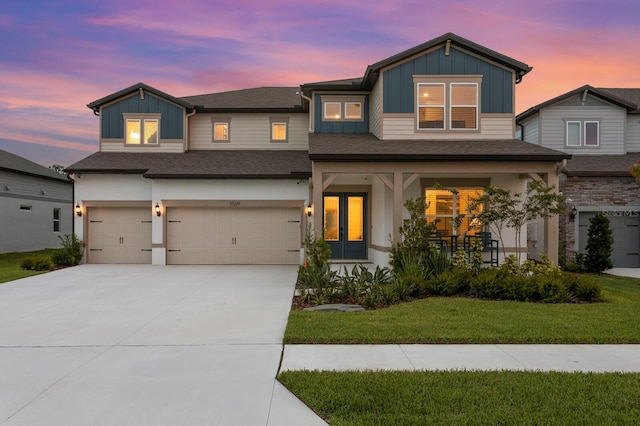 3559 Maple Bay Ln, Land O Lakes, FL 34638 - view of front facade featuring board and batten siding, an attached garage, a front lawn, and concrete driveway