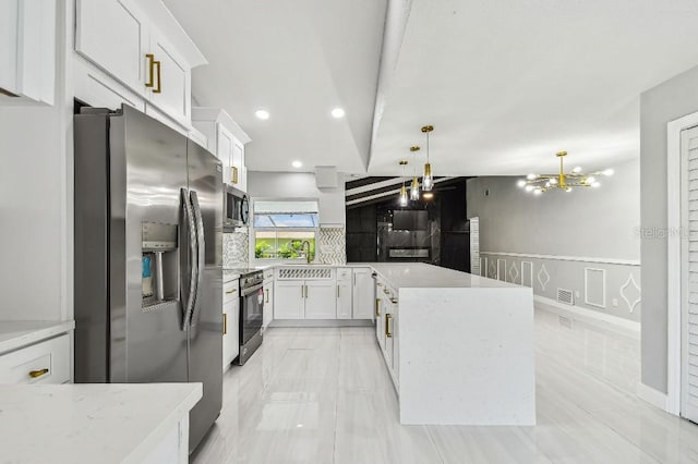 325 Gladstone Blvd, Englewood, FL 34223 - kitchen with appliances with stainless steel finishes, white cabinetry, a chandelier, hanging light fixtures, and recessed lighting