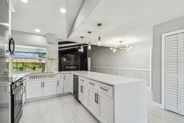325 Gladstone Blvd, Englewood, FL 34223 - kitchen featuring black range with electric cooktop, a peninsula, light countertops, pendant lighting, and a chandelier