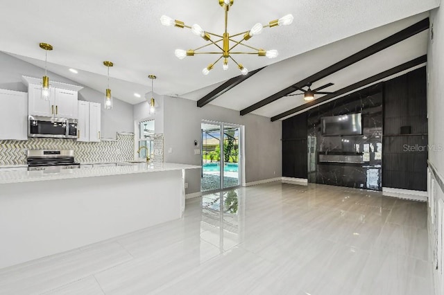 325 Gladstone Blvd, Englewood, FL 34223 - kitchen with stainless steel appliances, open floor plan, decorative backsplash, white cabinetry, and ceiling fan