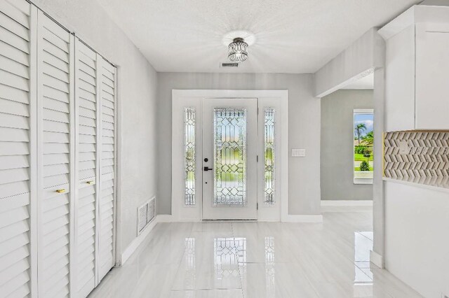 325 Gladstone Blvd, Englewood, FL 34223 - foyer entrance with baseboards
