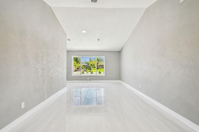 325 Gladstone Blvd, Englewood, FL 34223 - unfurnished room featuring baseboards and a textured wall