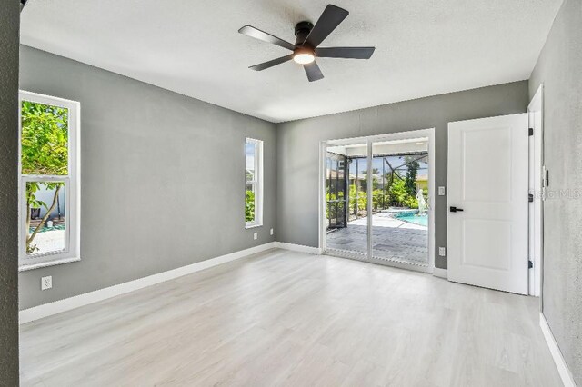 325 Gladstone Blvd, Englewood, FL 34223 - empty room with wood finished floors and a ceiling fan