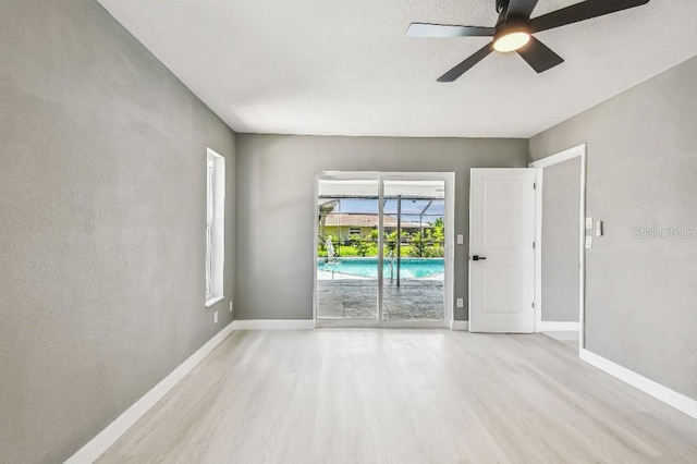 325 Gladstone Blvd, Englewood, FL 34223 - empty room featuring wood finished floors and ceiling fan