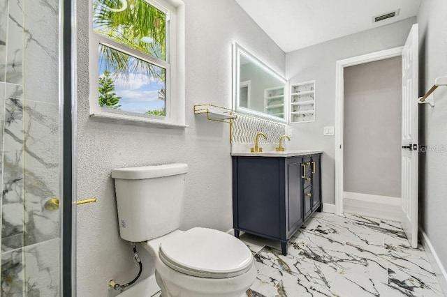 325 Gladstone Blvd, Englewood, FL 34223 - bathroom with vanity, marble finish floors, and a marble finish shower