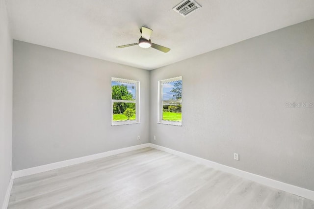 325 Gladstone Blvd, Englewood, FL 34223 - spare room with light wood finished floors and a ceiling fan