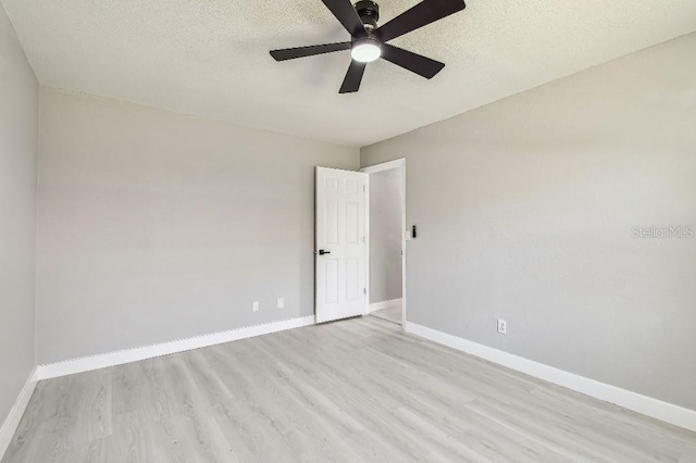 325 Gladstone Blvd, Englewood, FL 34223 - spare room featuring light wood finished floors, ceiling fan, and a textured ceiling