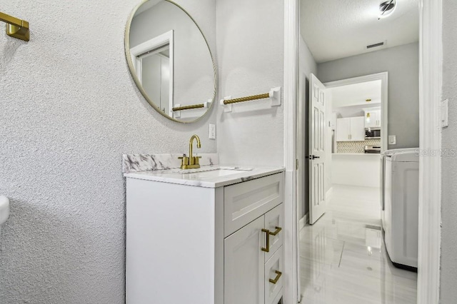 325 Gladstone Blvd, Englewood, FL 34223 - bathroom featuring vanity and a textured wall
