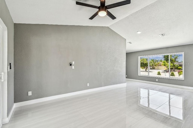 325 Gladstone Blvd, Englewood, FL 34223 - unfurnished room with a ceiling fan, lofted ceiling, and a textured wall