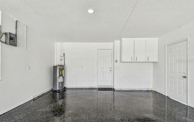 325 Gladstone Blvd, Englewood, FL 34223 - garage with water heater and baseboards