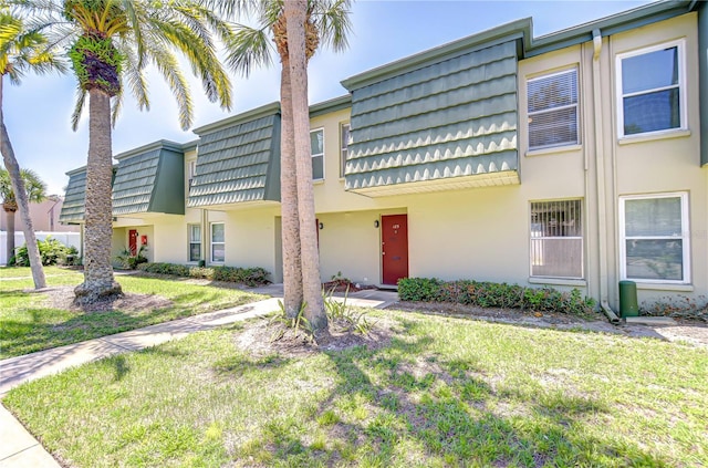 1799 N Highland Ave Unit 185, Clearwater, FL 33755 - multi unit property featuring mansard roof, stucco siding, and a front lawn