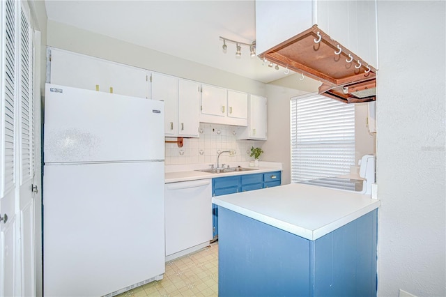 1799 N Highland Ave Unit 185, Clearwater, FL 33755 - kitchen featuring white appliances, a sink, light floors, blue cabinets, and light countertops