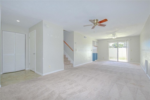1799 N Highland Ave Unit 185, Clearwater, FL 33755 - unfurnished living room featuring ceiling fan, stairs, baseboards, carpet floors, and recessed lighting