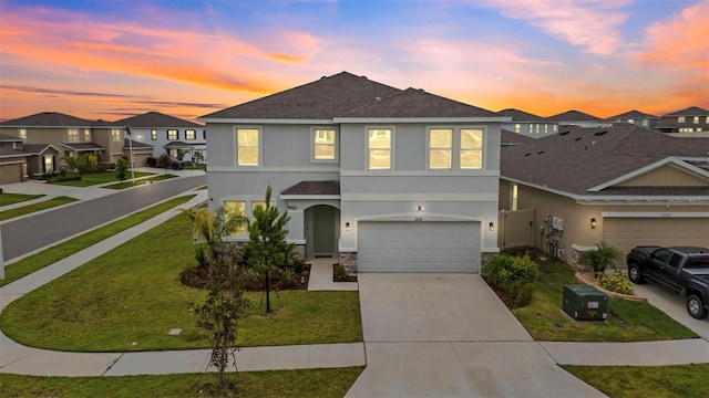 32136 Conchshell Sail St, Wesley Chapel, FL 33545 - view of front of home featuring stucco siding, a garage, concrete driveway, stone siding, and roof with shingles