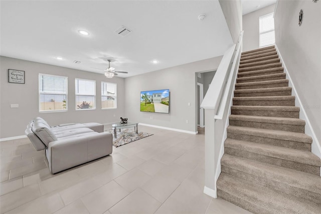 32136 Conchshell Sail St, Wesley Chapel, FL 33545 - living room featuring stairs, baseboards, ceiling fan, light tile patterned flooring, and recessed lighting