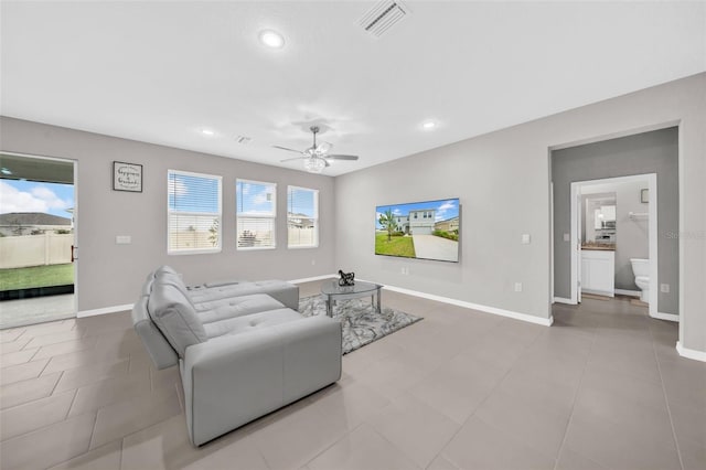 32136 Conchshell Sail St, Wesley Chapel, FL 33545 - living room featuring a ceiling fan, baseboards, recessed lighting, and tile patterned flooring
