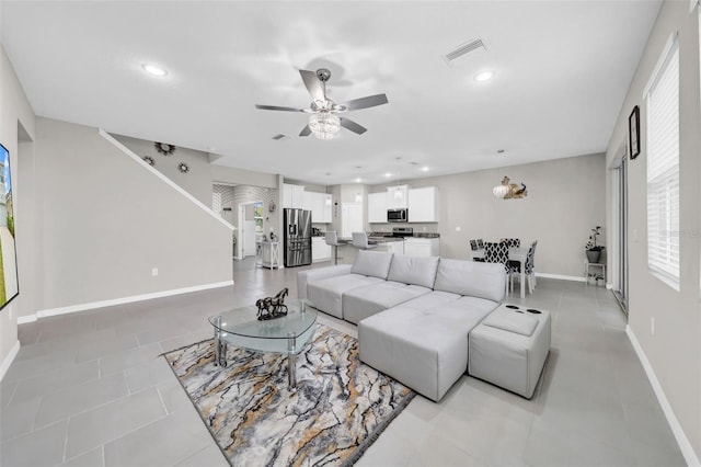 32136 Conchshell Sail St, Wesley Chapel, FL 33545 - living area featuring a ceiling fan, baseboards, recessed lighting, and light tile patterned floors
