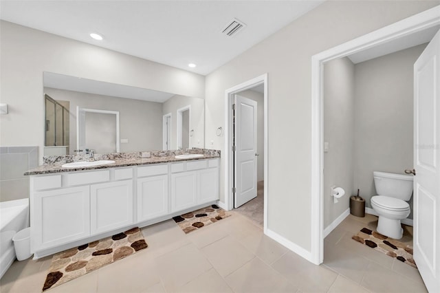 32136 Conchshell Sail St, Wesley Chapel, FL 33545 - full bath with double vanity, toilet, a bath, a shower stall, and tile patterned floors