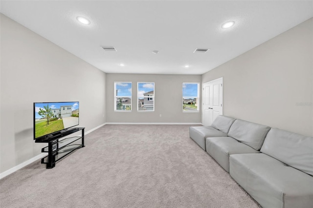 32136 Conchshell Sail St, Wesley Chapel, FL 33545 - living room with carpet floors, baseboards, and recessed lighting
