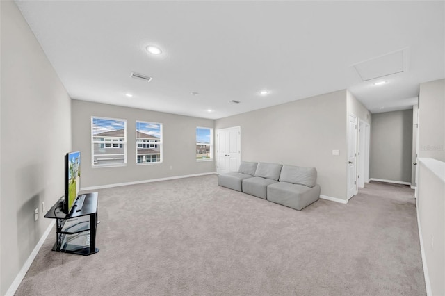 32136 Conchshell Sail St, Wesley Chapel, FL 33545 - carpeted living room featuring baseboards, recessed lighting, and attic access