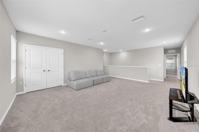 32136 Conchshell Sail St, Wesley Chapel, FL 33545 - unfurnished living room featuring carpet, baseboards, and recessed lighting