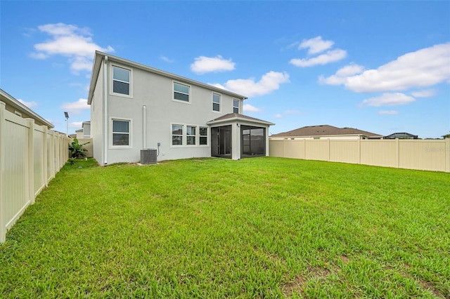 32136 Conchshell Sail St, Wesley Chapel, FL 33545 - rear view of house featuring central air condition unit, a sunroom, and stucco siding