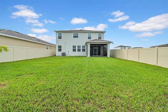 32136 Conchshell Sail St, Wesley Chapel, FL 33545 - rear view of house featuring central AC unit, a sunroom, and stucco siding