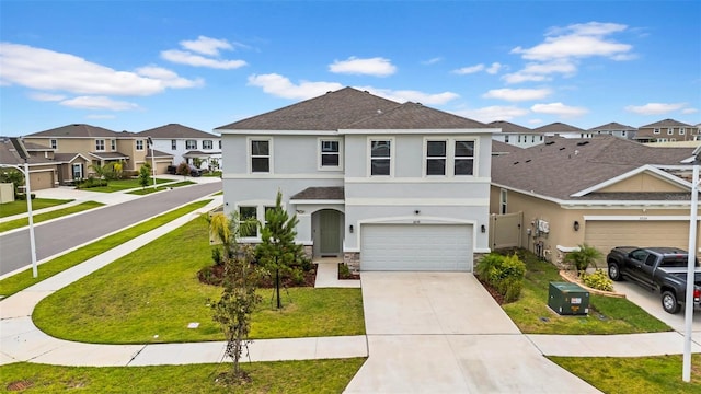 32136 Conchshell Sail St, Wesley Chapel, FL 33545 - view of front of property with stucco siding, a residential view, stone siding, a garage, and concrete driveway