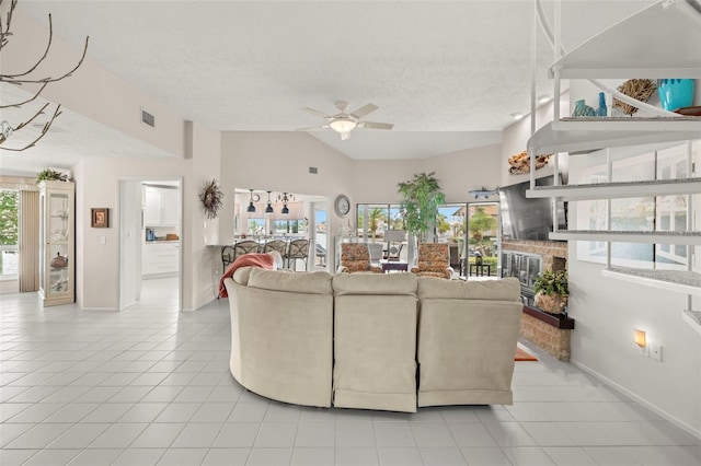 5782 Westshore Dr, New Port Richey, FL 34652 - tiled living area featuring ceiling fan, lofted ceiling, baseboards, and a textured ceiling
