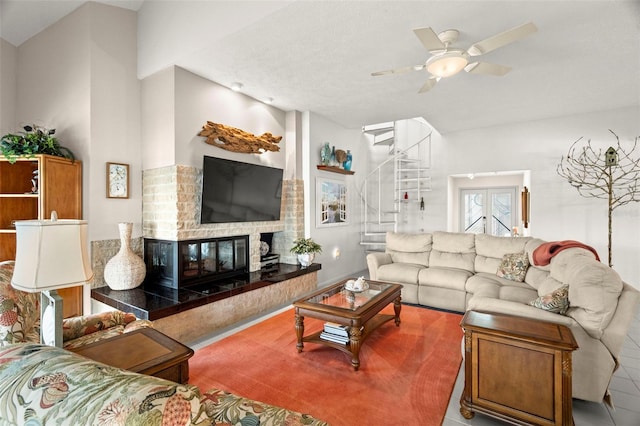 5782 Westshore Dr, New Port Richey, FL 34652 - living area with stairway, ceiling fan, and a brick fireplace