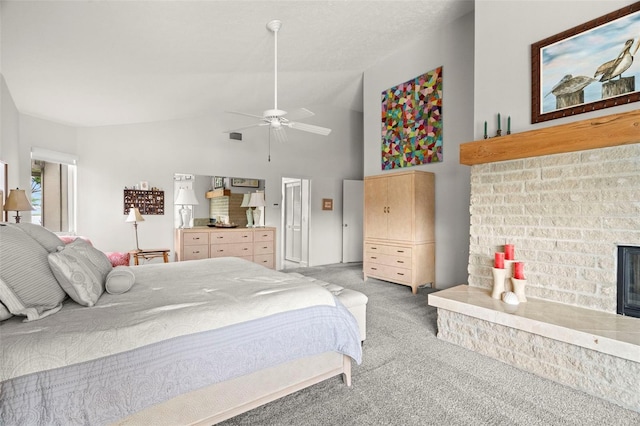 5782 Westshore Dr, New Port Richey, FL 34652 - carpeted bedroom featuring a brick fireplace, lofted ceiling, and a ceiling fan