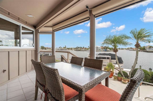 5782 Westshore Dr, New Port Richey, FL 34652 - sunroom / solarium with a water view and tile patterned floors