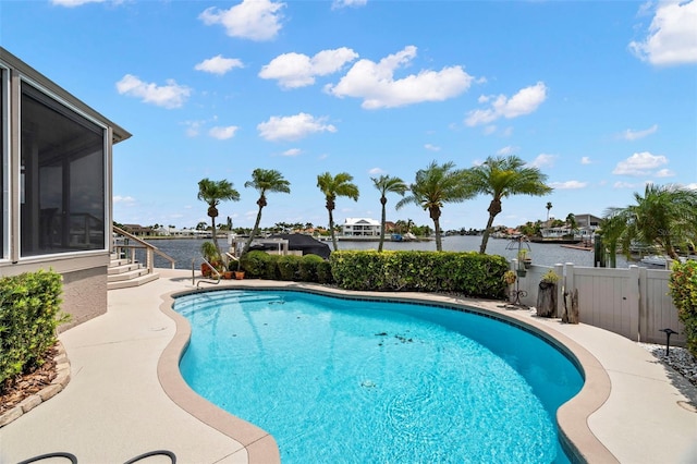 5782 Westshore Dr, New Port Richey, FL 34652 - view of pool with a water view, a sunroom, and a patio area