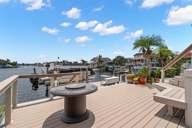 5782 Westshore Dr, New Port Richey, FL 34652 - wooden terrace with a water view, boat lift, and a boat dock