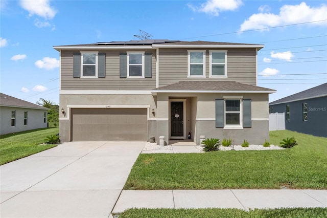 12481 Aston Dr, Hudson, FL 34669 - view of front facade with roof mounted solar panels, a garage, a front lawn, driveway, and stucco siding