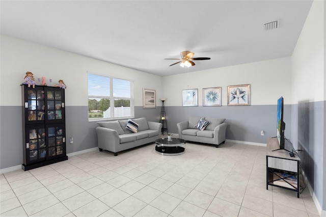12481 Aston Dr, Hudson, FL 34669 - living room with ceiling fan, baseboards, and light tile patterned floors