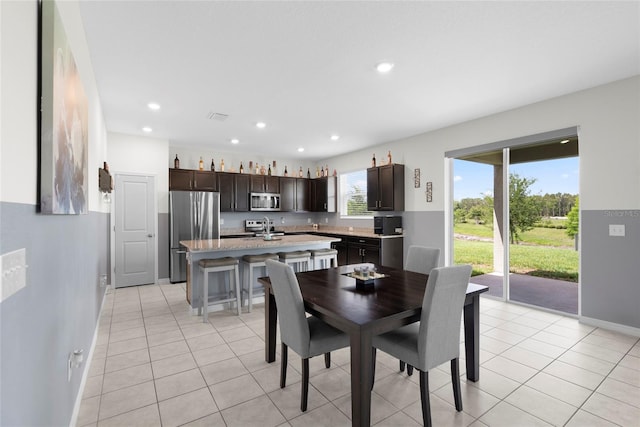12481 Aston Dr, Hudson, FL 34669 - dining area with light tile patterned flooring, recessed lighting, and baseboards