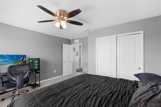 12481 Aston Dr, Hudson, FL 34669 - carpeted bedroom with a closet, ceiling fan, and baseboards
