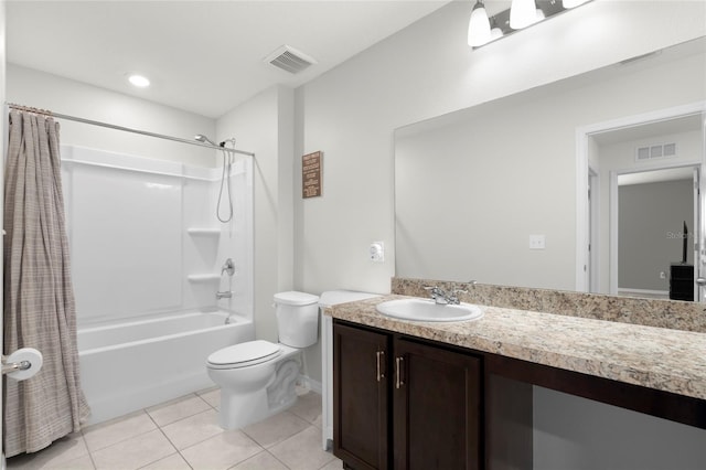 12481 Aston Dr, Hudson, FL 34669 - full bath featuring shower / tub combo, toilet, tile patterned flooring, vanity, and baseboards