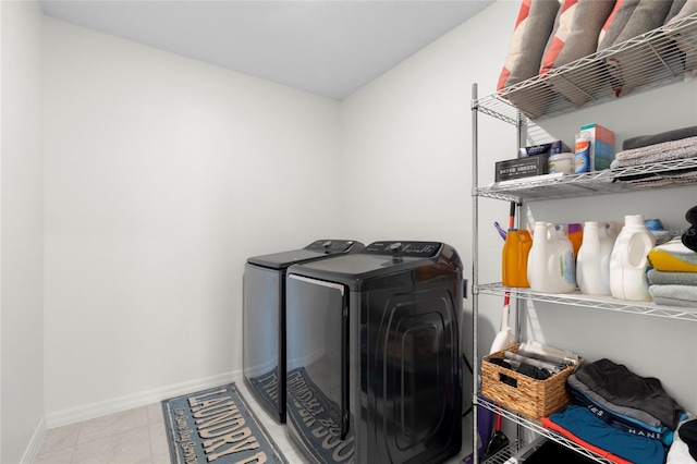 12481 Aston Dr, Hudson, FL 34669 - washroom featuring washing machine and dryer, baseboards, and tile patterned flooring