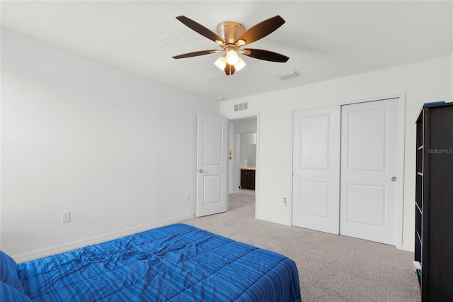 12481 Aston Dr, Hudson, FL 34669 - carpeted bedroom with baseboards, ceiling fan, and a closet